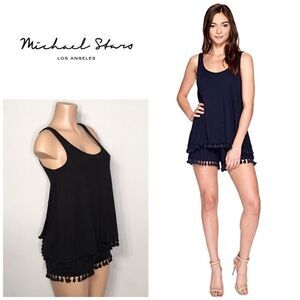 Michael Stars black romper with pom-poms. New